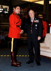 Cst. Pernell Cardinal accepts the Bronze Medal from Lt. Gov. Donald S. Ethell. 