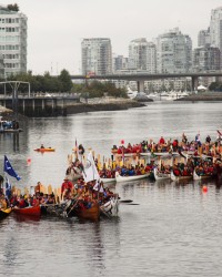 Salish canoe flotilla at Vancouver's False Creek