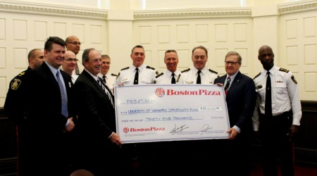 Boston Pizza presents cheque to University of Winnipeg
