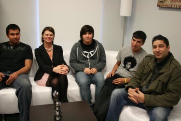 Principal Jean Stiles and Sean Lessard (far right) sit with three of the student