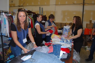 Sorting through the boxes of clothes are Travelodge workers (from left) Becky Pa