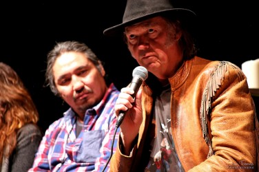 Athabasca Chipewyan First Nation Chief Allan Adam watches on as singer songwrite