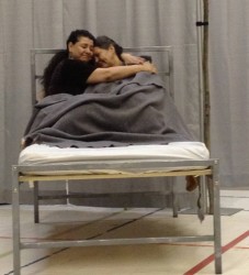 Darlene Auger and Roxanne Blood in an Indian residential school scene of two lit