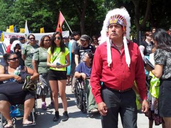 Grassy Narrows Chief Roger Fobister Sr. leads the march through downtown Toronto