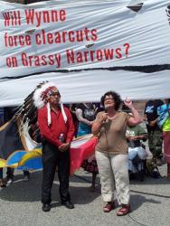 Grassy Narrows Chief Roger Fobister Sr looks on as political activist Judy Rebic