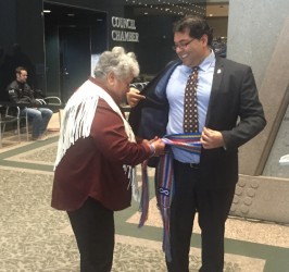 Calgary Mayor Naheed Nenshi receives his first Métis sash from Marlene Lanz, pre