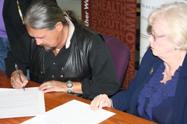 Merle White and Joan Cowling sign agreement