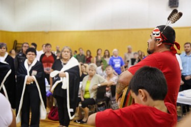 Tsleil-Waututh language and culture manager Gabriel George (right) speaks at a f