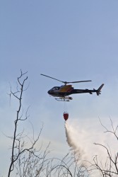 Helicopters try to keep fires under control