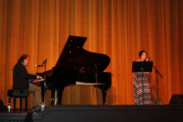Tomson Highway on the piano is accompanied by local Métis singer Krystle Pederso