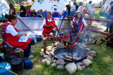 Alysha Raine prepared juice whileNancy Ear and Janeta Ear rolled and cooked bann