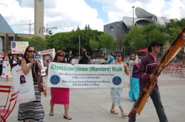 April Eve Wiberg (with the megaphone) has helped lead events in Edmonton
