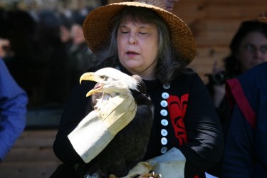 Kim Relcalma-Clutsei, member of the Qualicum Band with eagle