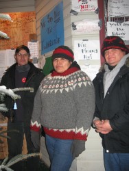 Dan Yunkwas, Melanie Smoke and Mark Smoke stand outside the boarded up Gitxan Tr