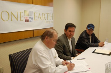 Chief Gerry Ermineskin signs the agreement as the other signatories Blaine Favel