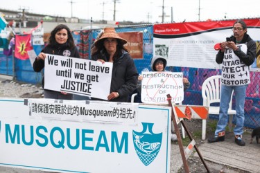 Musqueam sisters and blockade spokeswomen Cecilia (left) and Mary Point stand wa