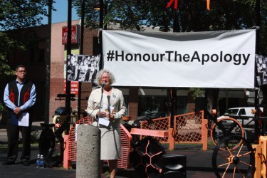 Lewis Cardinal watches on as NDP Edmonton Strathcona MP Linda Duncan addresses c