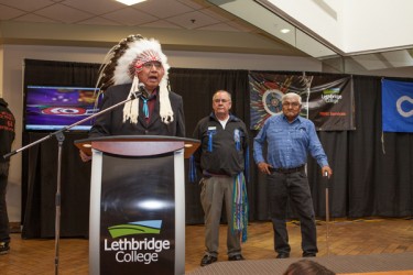Métis Elder Rod McLeod (centre) is flanked by Blackfoot Elder