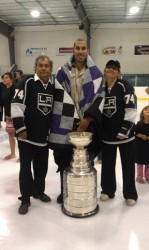 Dwight King (center) presented quilt from Chief Jim Norman (le