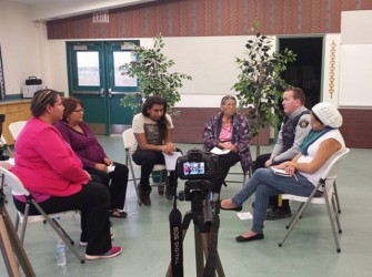 Vanessa Omeasoo, restorative justice coordinator, works with community members