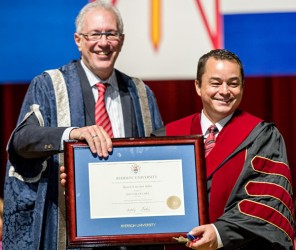 Ryerson University President Sheldon Levy (left) presents National Chief Shawn A