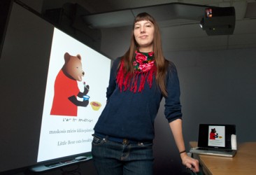 Caylie Gnyra with her e-book creation Little Bear.