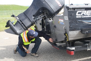 Checking out watercraft for unwanted aquatic species
