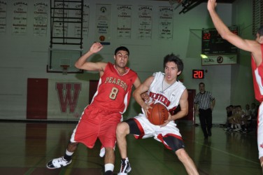 Ammon Crowfoot (with ball) helped his basketball team earn provincial championsh