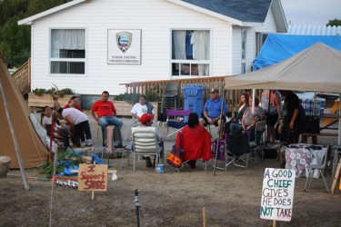 Community members waiting for General Assembly to start where Councillors Derek 