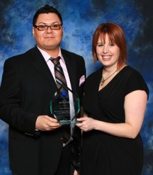 Massey Whiteknife accepts the Youth Entrepreneur Award of Distinction