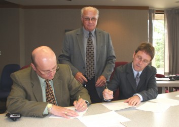 (From left) Dr. Trent Keough, president of Portage College, Paul Ponich, board c