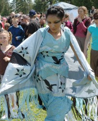 Shannen Koostachin dancing at an event.