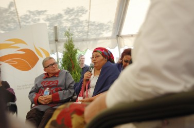 Hereditary Chief Robert Joseph looks on as Leanne Sleigh answers the question po