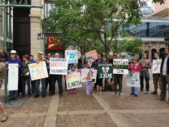 Members of First Nations and environmental groups gathered in front of Canadian 