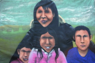 Jacqueline Crazybull, with her children, was painted by Jesse Gouchey