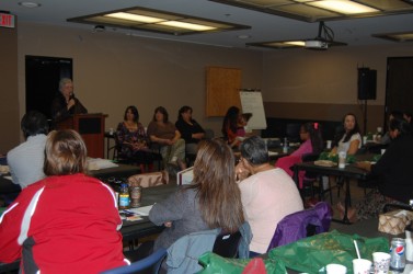 Marilyn Buffalo speaks as panelists (from left) Lana Whiskey Jack, Mary McDermot