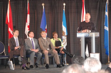 Mike Holmes addresses the crowd at the official opening of Renaissance Tower. On