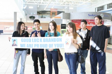 Some classmates from Oskayak came to the airport to wish Brandon Sand (second fr