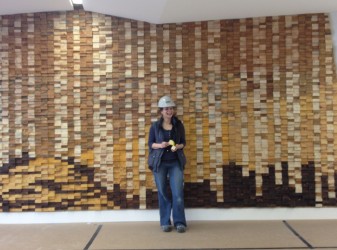 Destiny Swiderski in front of her creation, “Milled Woods.” 