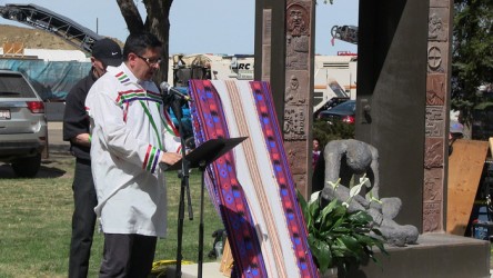 Rev. Travis Enright leads the service held at the Homeless Memorial Statue.