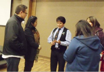 Chief Clarence Louie talks to a small group of people after his presentation. 