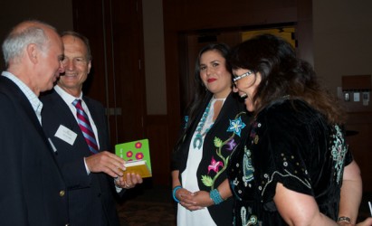 Neepin Auger, with her mother Grace, shows Stan Carscallen of Carscallen LLP and
