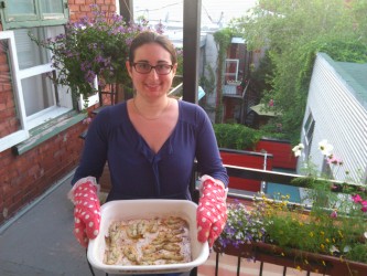 Marie-Anne Gagnon holds a pan of broiled perch, which was caught by her father, 