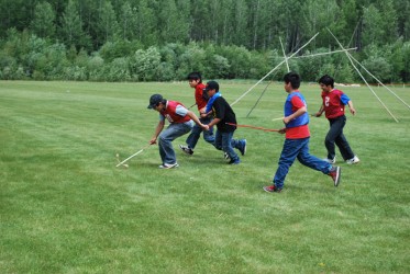 A fierce game of Double Ball is played at the First ever Treaty 8 Games.