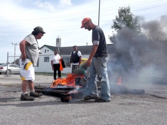 Bonfire at the gates of former army camp