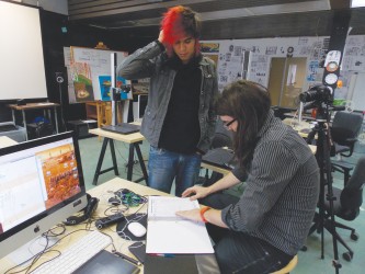 Christian Boulet (standing), one of the artists for “Ihtsipatatiyoop,”  discusse