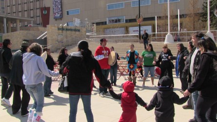 Casey Julian Thunderspirit drums for a round dance as part of a march and rally 