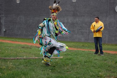 Grass dancer Jason E. Skani, from Cold Lake First Nation, accompanied by drummer