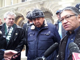 Charlie Angus, Andrew Wesley and Ed Metatawabin address the media in front of 